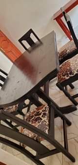 A picture of Dinning table with adh fridge both for sell at 800k