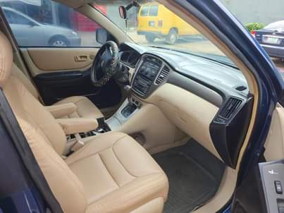 A picture of TOKUBO STANDARD USED TOYOTA HIGHLANDER UPGRADED TO 2005 DIRECT OWNER