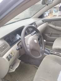 A picture of Toyota Corolla Color Blue Model 2003 Neatly Nigeria used AC