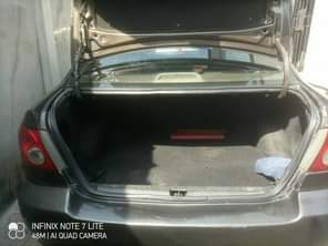 A picture of Toyota corolla 2004 model With sharpest interior nd indomie rims