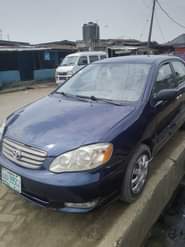 A picture of Toyota Corolla Color Blue Model 2003 Neatly Nigeria used AC