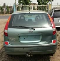 A picture of Clean Nissan Almera Tino Green colour Four airbags Factory A