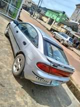 A picture of URGENT SALE Registered Mazda 323f auto drive 4lugs engine gear