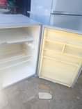 A picture of Friji 140000 kabati 270000 show case 150000 call 0655194001