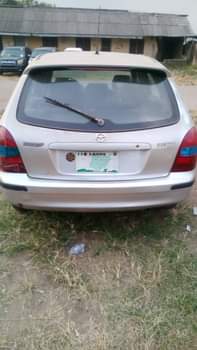 A picture of Mazda 323 still working well Owner 700 last Settlement 50