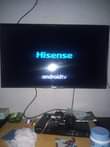 A picture of Hisense 32 smart tv with remote
