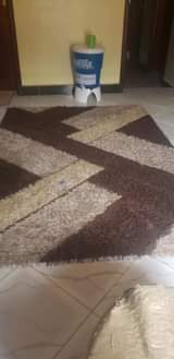 A picture of Matress dressing mirror and center carpet