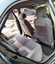 A picture of Clean Nigerian Used Grey Toyota Corolla 2003 Repainted Fabric interior