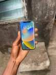 A picture of Iphone x no face id with little color line on