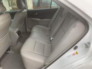 A picture of Toyota Camry 2014 White on Grey Interior