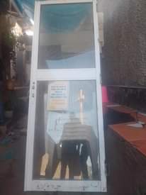 A picture of 6 mahogany doors and 1 Aluminium door