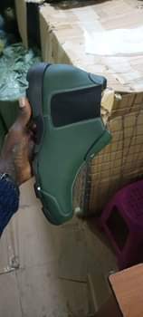 A picture of Men s boot long durable original color green
