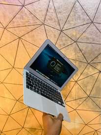A picture of MacBook Air 2013 4gb ram 128gb SSD storage keyboard light