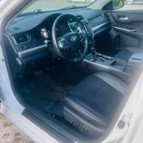 A picture of A fairly used car with a sound engine and gear
