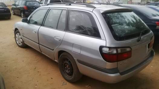 A picture of Fabric seat Manual gear Tapping glass Car situated in the