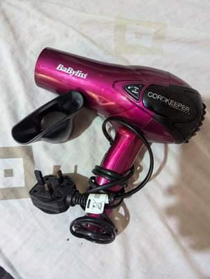 A picture of Hairdryer and hair straightener