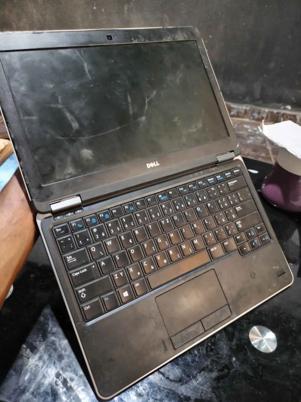 A picture of Dell laptop with SSD needs servicing 