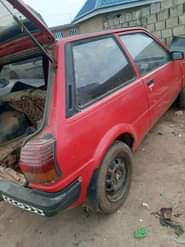 A picture of Toyota starlet two doors with smoking engine location Ibadan price