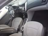 A picture of 2014 model accent bought brand new everything intact 2 1m