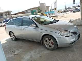 A picture of WAGON USED BY A LADY 2005 NISSAN PRIMERA WITH REVERSE