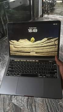 A picture of 2020 MacBook Pro m1 with finger print