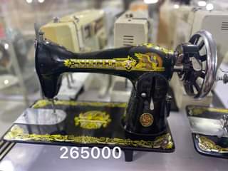 A picture of Sewing machines complete set with the stand