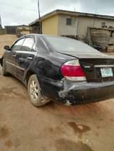 A picture of Toyota Camry 2004model engine and gear is okay AC needs