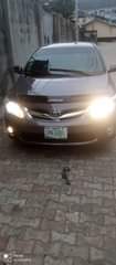 A picture of Toyota Corolla model 2010 engine gear box AC chilling clean