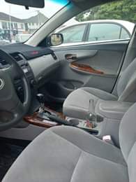 A picture of 2010 model of Toyota Corolla engine body ac very okay