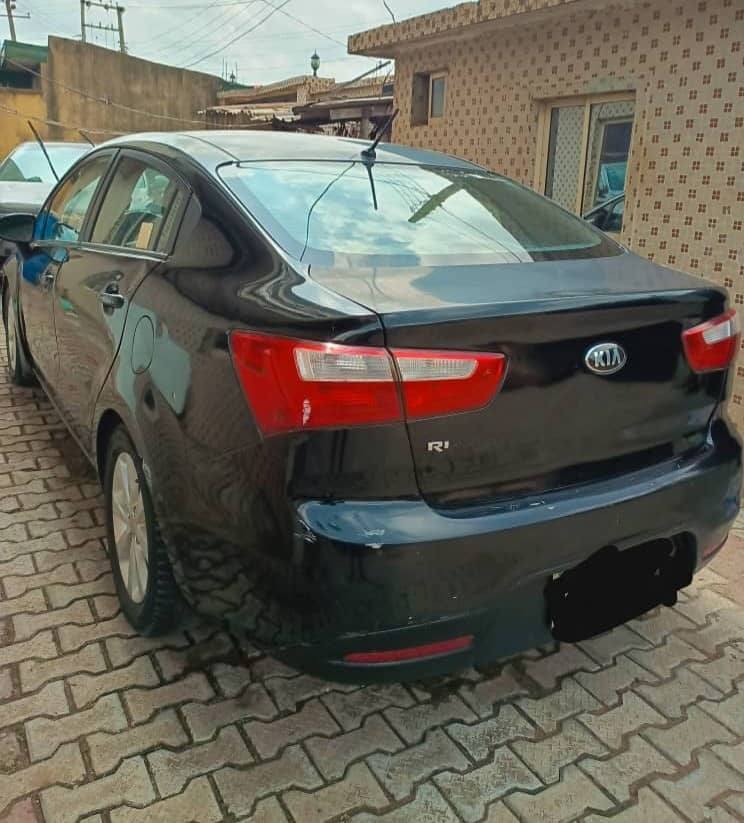 A picture of . Clean Well Maintained Registered Black Kia Rio 2015. 