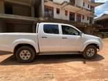 A picture of Hilux Vigo and TVS Star on sale location Luzira kirombe