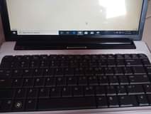 A picture of HP laptop with Original New battery and charger