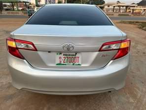 A picture of 2014 model Toyota Camry LE Available Four plugs engine full