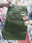 A picture of Kaki cargo pants Price ugx 65 000 Call Whatsapp me