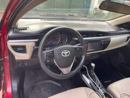 A picture of 2015 Corolla LE is Neatly flashed on First body with
