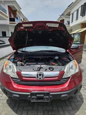 A picture of A Red Honda CR V Jeep.