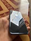 A picture of Iphone x 64gb with face id and true tone 100