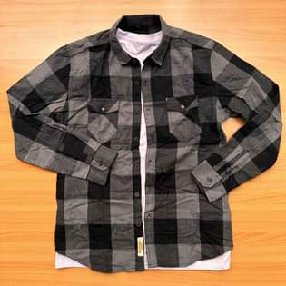 A picture of Original flannel shirts available Call whatsapp 0759636169 Inbox for orders