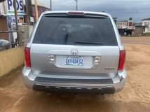 A picture of Honda pilot three rolls LESS THAN A YEAR REGISTERED