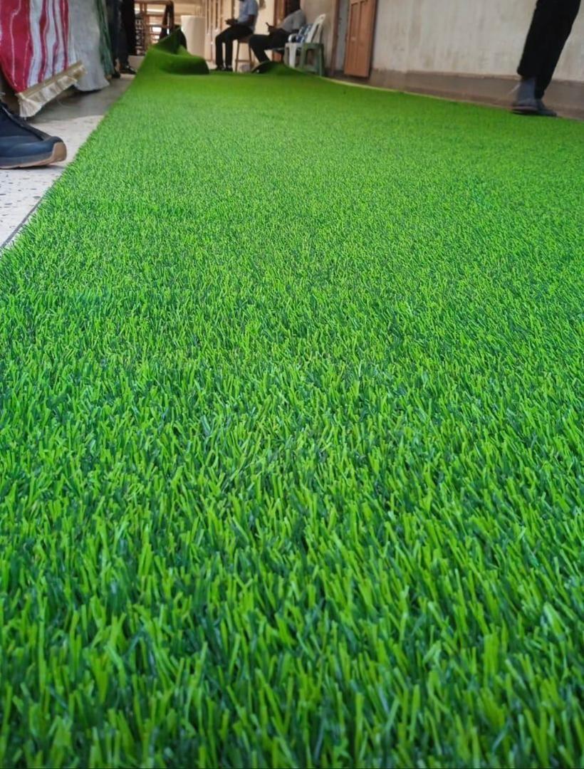 A picture of High quality artificial green grass carpet in good condition better
