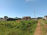 A picture of Muje Mbaguze Plots Lands Houses land surveying and Title processing
