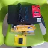 A picture of Playstation 2 complete yani full package ni kuchomeka kwa Tv