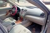 A picture of Neatly used Camry with little top noise but every other