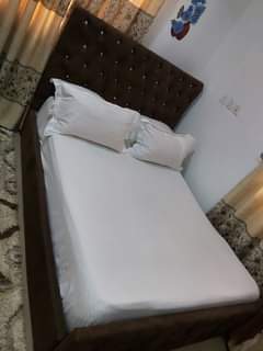 A picture of Neatly tly used bed frame and mattress for sale everything