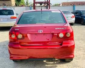 A picture of RED An Extremely Clean Used Toyota Corolla 2004 Model With