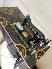 A picture of Sewing machines with their stands