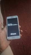 A picture of Samsung Galaxy grand prime Has some craxk