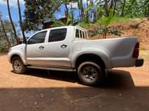 A picture of Hilux Vigo and TVS Star on sale location Luzira kirombe