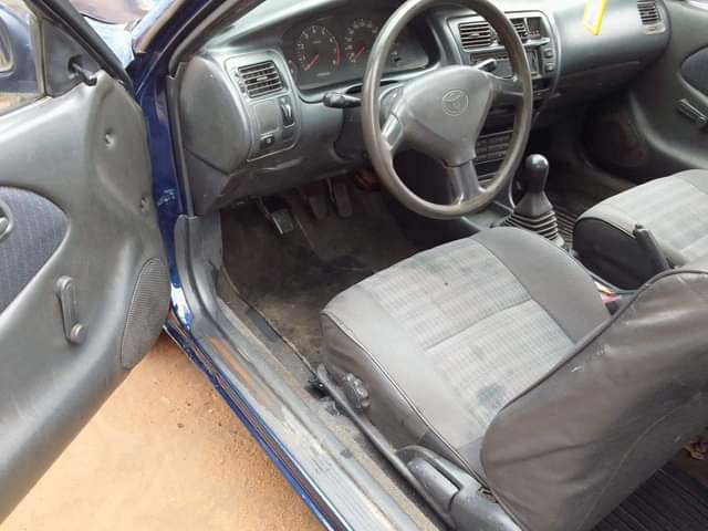 A picture of Toyota Corolla is available engine and gear is ok