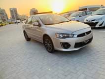 A picture of 0563289778 Mitsubishi Lancer mid option for sale bank auto loan